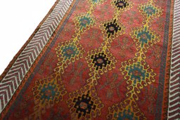Backside of handmade 2000s Persian Gabbeh rug showing knot structure and weave density