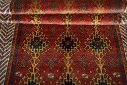 Full view of 2000s Persian Gabbeh rug from Iran / Persia, 231 × 124 cm in Red tones