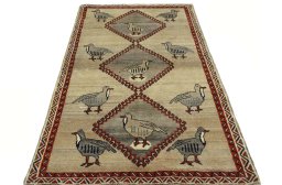 Surface texture of 2000s Persian Gabbeh rug with natural Wool and intricate pattern