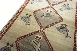Backside of handmade 2000s Persian Gabbeh rug showing knot structure and weave density