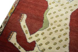 Backside of handmade 2000s Persian Gabbeh rug showing knot structure and weave density