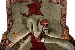 Corner detail of 2000s Persian Gabbeh rug showing border pattern and Wool pile