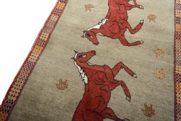 Backside of handmade 2000s Persian Gabbeh rug showing knot structure and weave density