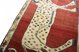 Backside of handmade 2000s Persian Gabbeh rug showing knot structure and weave density