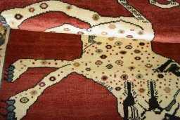 Full view of 2000s Persian Gabbeh rug from Iran / Persia, 146 × 102 cm in Red tones