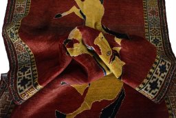 Corner detail of 2000s Persian Gabbeh rug showing border pattern and Wool pile