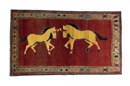 Full view of 2000s Persian Gabbeh rug from Iran / Persia, 214 × 123 cm in Red tones