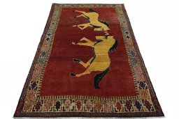 Surface texture of 2000s Persian Gabbeh rug with natural Wool and intricate pattern