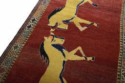 Backside of handmade 2000s Persian Gabbeh rug showing knot structure and weave density