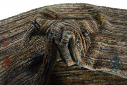 Corner detail of 2000s Persian Gabbeh rug showing border pattern and Wool pile