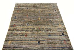 Surface texture of 2000s Persian Gabbeh rug with natural Wool and intricate pattern
