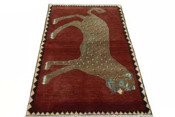 Surface texture of 2000s Persian Gabbeh rug with natural Wool and intricate pattern
