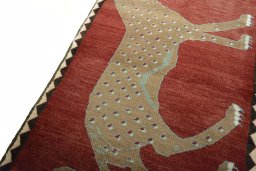 Backside of handmade 2000s Persian Gabbeh rug showing knot structure and weave density