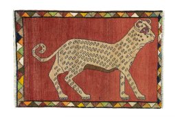 Full view of 2000s Persian Gabbeh rug from Iran / Persia, 115 × 76 cm in Red tones