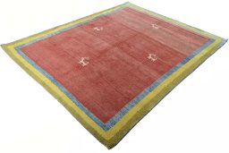 Corner detail of 2000s Persian Gabbeh rug showing border pattern and Wool pile