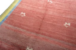 Backside of handmade 2000s Persian Gabbeh rug showing knot structure and weave density