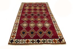 Surface texture of 2000s Persian Gabbeh rug with natural Wool and intricate pattern