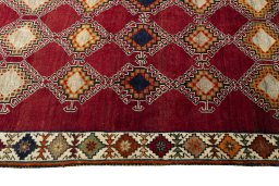 Close-up detail of 2000s Persian Gabbeh rug from Iran / Persia showing Wool weave