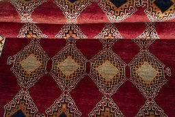 Full view of 2000s Persian Gabbeh rug from Iran / Persia, 235 × 138 cm in Red tones