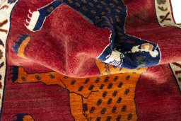 Corner detail of 2000s Persian Gabbeh rug showing border pattern and Wool pile