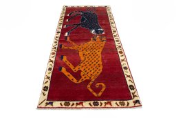 Surface texture of 2000s Persian Gabbeh rug with natural Wool and intricate pattern
