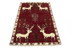 Surface texture of 2000s Persian Gabbeh rug with natural Wool and intricate pattern