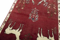 Backside of handmade 2000s Persian Gabbeh rug showing knot structure and weave density