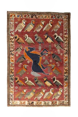 Full view of 2000s Persian Gabbeh rug from Iran / Persia, 215 × 143 cm in Red tones
