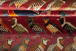 Full view of 2000s Persian Gabbeh rug from Iran / Persia, 215 × 143 cm in Red tones