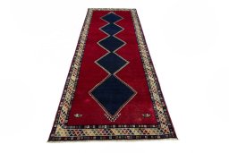 Surface texture of 2000s Persian Gabbeh rug with natural Wool and intricate pattern