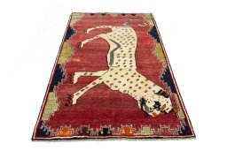 Surface texture of 2000s Persian Gabbeh rug with natural Wool and intricate pattern