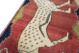 Backside of handmade 2000s Persian Gabbeh rug showing knot structure and weave density