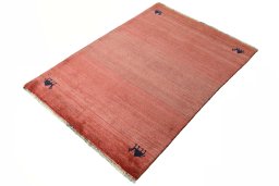 Corner detail of 2000s Persian Gabbeh rug showing border pattern and Wool pile