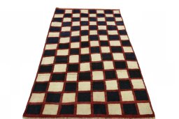 Surface texture of 2000s Persian Gabbeh rug with natural Wool and intricate pattern
