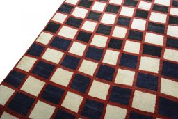 Backside of handmade 2000s Persian Gabbeh rug showing knot structure and weave density