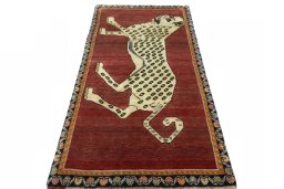 Surface texture of 2000s Persian Gabbeh rug with natural Wool and intricate pattern