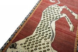 Backside of handmade 2000s Persian Gabbeh rug showing knot structure and weave density