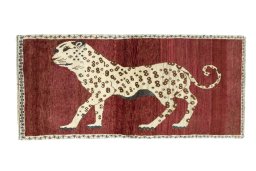 Full view of 2000s Persian Gabbeh rug from Iran / Persia, 177 × 83 cm in Red tones