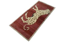 Corner detail of 2000s Persian Gabbeh rug showing border pattern and Wool pile