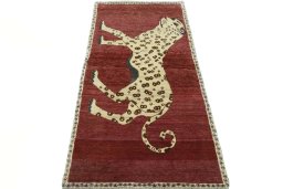Surface texture of 2000s Persian Gabbeh rug with natural Wool and intricate pattern