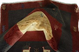 Corner detail of New Persian Gabbeh rug showing border pattern and Wool pile