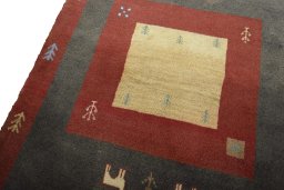 Backside of handmade New Persian Gabbeh rug showing knot structure and weave density
