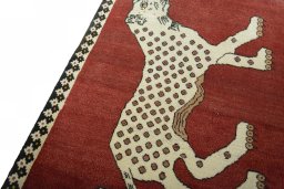 Backside of handmade 2000s Persian Gabbeh rug showing knot structure and weave density