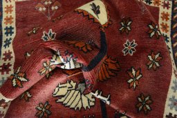 Corner detail of 2000s Persian Gabbeh rug showing border pattern and Wool pile