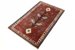 Corner detail of 2000s Persian Gabbeh rug showing border pattern and Wool pile