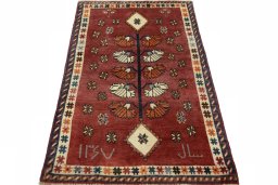 Surface texture of 2000s Persian Gabbeh rug with natural Wool and intricate pattern