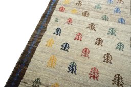 Backside of handmade 2000s Persian Gabbeh rug showing knot structure and weave density