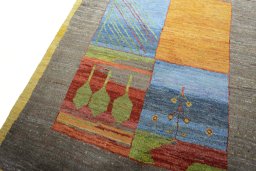 Backside of handmade New Persian Gabbeh rug showing knot structure and weave density