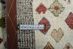 Close-up detail of 2000s Persian Gabbeh rug from Iran / Persia showing Wool weave