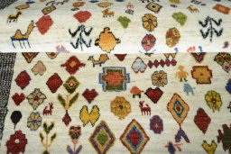 Full view of 2000s Persian Gabbeh rug from Iran / Persia, 144 × 100 cm in Beige tones